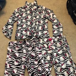 Hello Kitty pajamas. 2 pants. 2 tops. All Large.